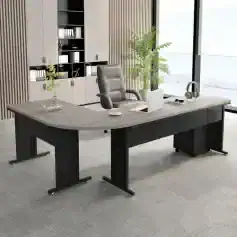 Modern office desk with ergonomic chair, headphones, laptop, and decorative plants, ideal for optometry clinic or professional workspace, showcasing sleek design.