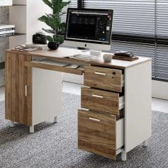 Highly functional optical shop desk with computer, camera gear, and storage drawers for optometry practice.