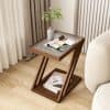 Elegant bedroom side table featuring a glass top and shelf, perfect for storing glasses and reading materials in an optometry or eyewear store setting.