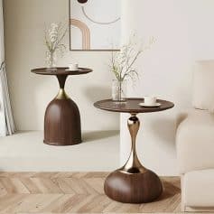 Stylish side tables featuring minimalist design, glass vases with flowers, and cozy living room elements, perfect for enhancing contemporary interior aesthetics.
