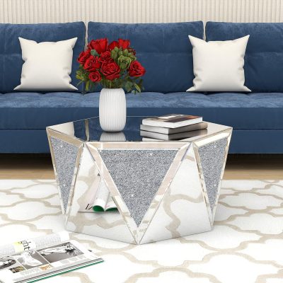 Serene and stylish living room decor with a blue velvet sofa, white throw pillows, a stunning geometric mirrored coffee table, and a colorful bouquet of red roses in a white vase, ideal for luxurious home aesthetics.