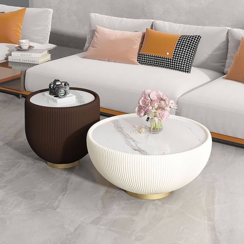 Stylish coffee tables for living rooms, featuring marble tops and textured bases in white and dark brown, ideal for modern interior design and creating an elegant, cozy space.