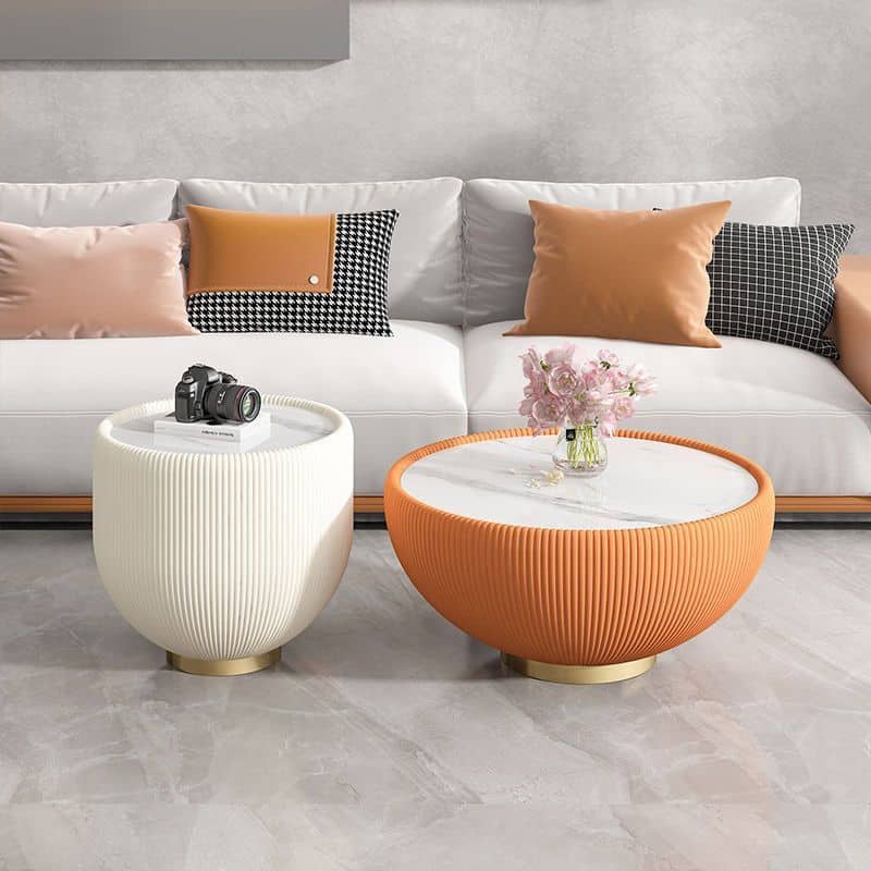 Stylish modern coffee tables with textured surfaces in white and orange, perfect for living room decor and enhancing your space's elegance and functionality.