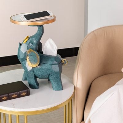 A chic elephant-shaped table lamp with a tissue holder design, perfect for modern bedroom or living room decor, combining functionality with artistic appeal.