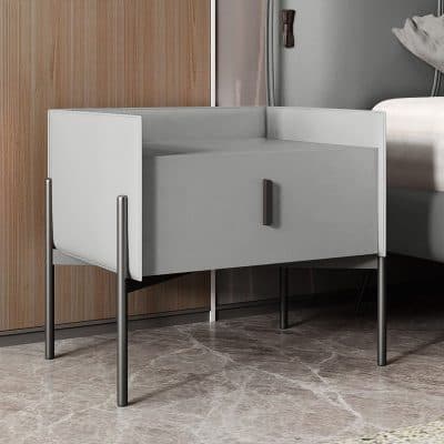 Stylish white bedside table with storage drawer and sleek black handle. Perfect for contemporary bedroom decor and storage solutions.