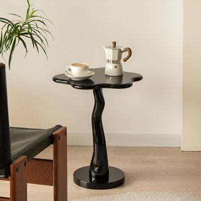 Stylish black wooden coffee table with coffee cups and a moka pot, perfect for contemporary home decor and leisure spaces.