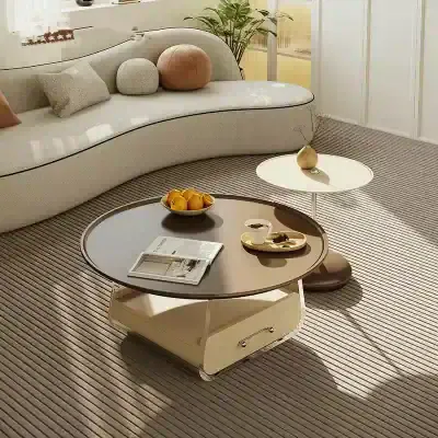 Modern living room furniture with stylish coffee tables, cozy sofa, and decorative cushions. Perfect for a contemporary interior, combining comfort and elegance.