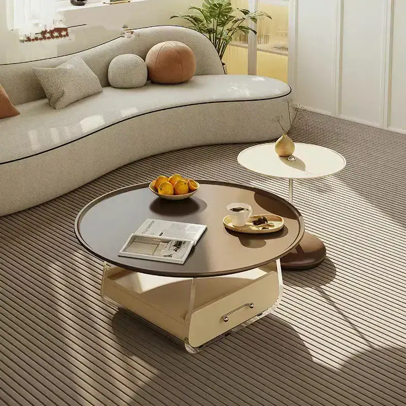 Modern living room furniture with stylish coffee tables, cozy sofa, and decorative cushions. Perfect for a contemporary interior, combining comfort and elegance.