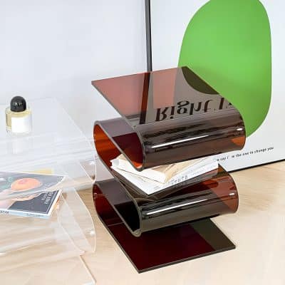 Enhance your interior with this contemporary magazine organizer made of tinted glass, combining aesthetic appeal with practicality. Ideal for living rooms, offices, or waiting areas.