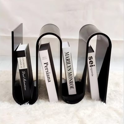 Stylish black and white book stand showcasing ophthalmology and optometry books including