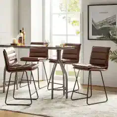 Elegant leather dining chairs with metal legs around a modern table, ideal for stylish kitchens or cafes, featuring natural light and contemporary decor.