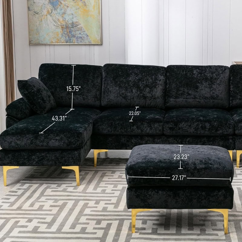Luxurious black velvet sectional sofa with matching ottoman featuring gold finish legs, perfect for sophisticated living areas and stylish home decor.