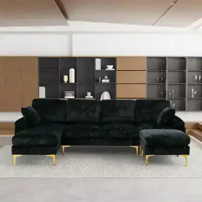Elegant black velvet sectional sofa with gold accents, modern design, perfect for stylish living rooms and office spaces offering comfort and sophistication.