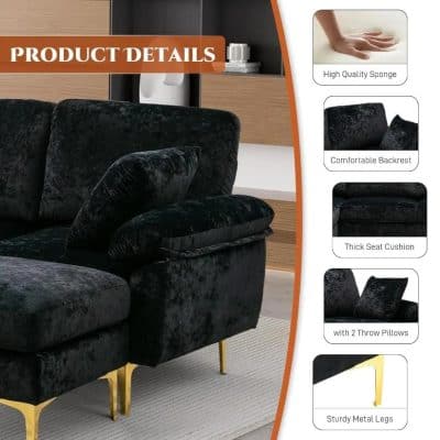 Luxurious black velvet sofa with comfy backrest, thick seat cushion, two throw pillows, and sturdy metal legs, perfect for modern living rooms.