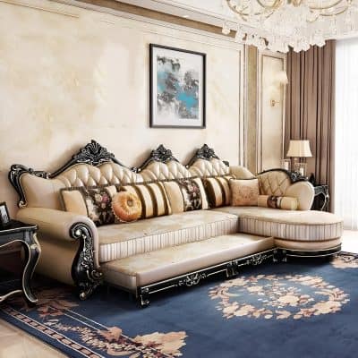 Luxurious living room sofa with intricate black and white carved details, plush cream upholstery, and assorted decorative pillows, ideal for a stylish, sophisticated home space.