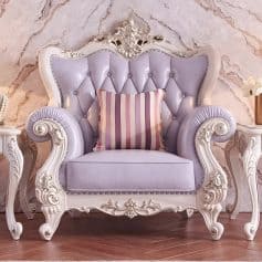 Luxurious vintage armchair with detailed white carved wood frame, lavender velvet upholstery, and button-tufted design, perfect for adding elegance to living spaces and enhancing interior decor.