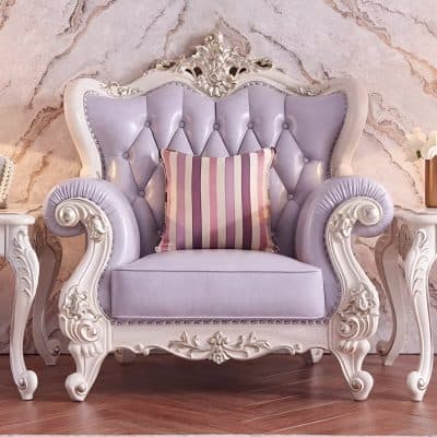Luxurious vintage armchair with detailed white carved wood frame, lavender velvet upholstery, and button-tufted design, perfect for adding elegance to living spaces and enhancing interior decor.