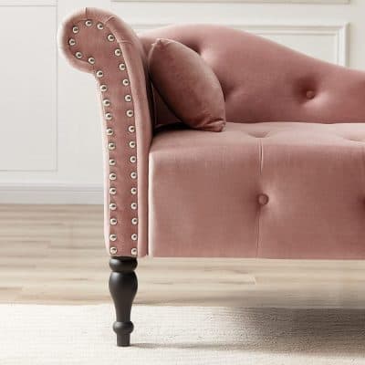 Luxurious pink velvet sofa with elegant nailhead trim and tufted design, perfect for stylish living rooms and modern interior decor.