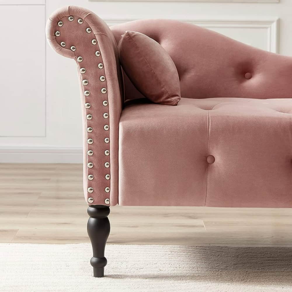 Luxurious pink velvet sofa with elegant nailhead trim and tufted design, perfect for stylish living rooms and modern interior decor.