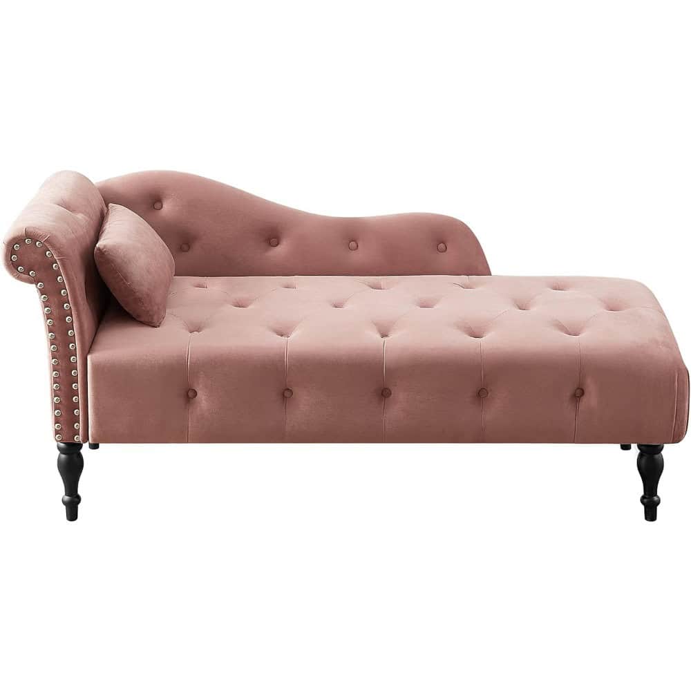 Elegant pink velvet sofa with tufted design, rolled armrest, and nailhead trim, perfect for luxury living rooms. Stylish and comfortable seating option for modern home decor.