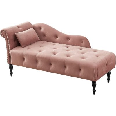 Comfortable pink velvet sofa with tufted design, elegant button details, and classic black wooden legs, perfect for modern living rooms or bedrooms.