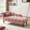 Elegant pink velvet sofa with tufted design, ideal for stylish living rooms and cozy spaces. Complements home décor with classic charm and modern comfort.