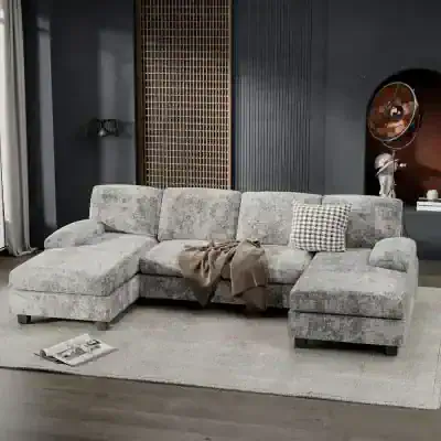 Stylish grey sectional sofa with plush cushions, ideal for modern living spaces. Comfortable seating with elegant design, perfect for family rooms or lounge areas. Make your home inviting with this contemporary furniture piece.