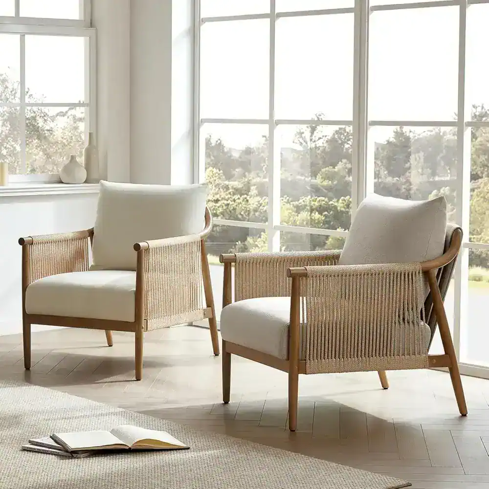 Elegant modern armchairs with woven rattan accents and plush cushions, perfect for contemporary home decor and reading Nooks.