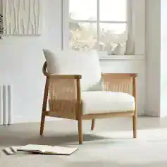 Bright and stylish wooden armchair with a plush white cushion, perfect for modern or minimalist living spaces, offering comfort and aesthetic appeal.