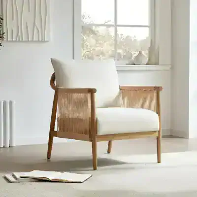 Bright and stylish wooden armchair with a plush white cushion, perfect for modern or minimalist living spaces, offering comfort and aesthetic appeal.