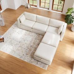 Elegant white sectional sofa with chaise lounge, perfect for contemporary home decor, comfort, and style. Ideal for living rooms, offering ample seating and a sleek design.