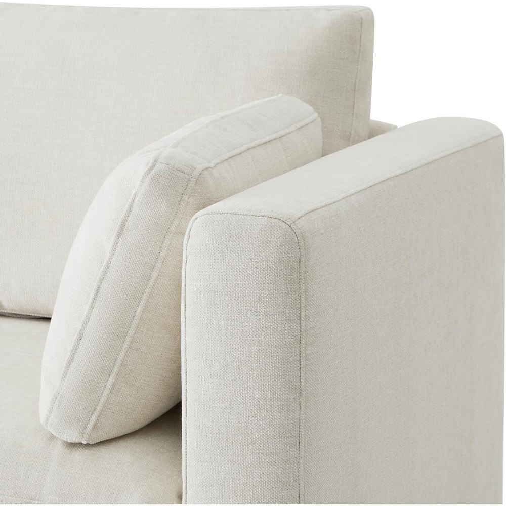 High-quality, comfortable sofa with plush cushions, perfect for living rooms seeking stylish relaxation furniture. Durable fabric and timeless design enhance home decor.