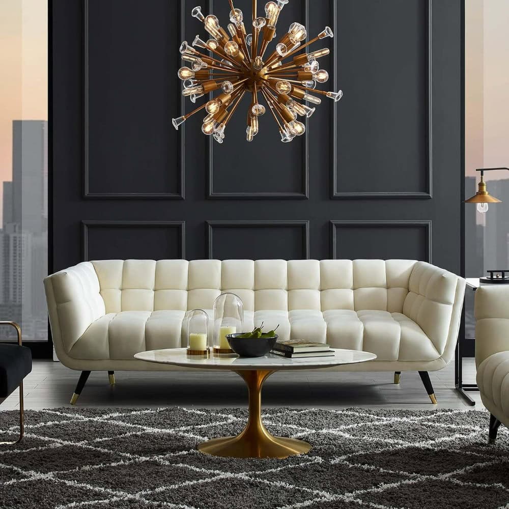 Luxurious modern sofa set featured in the Monalisa Store, with sophisticated wall decor and stylish chandelier, perfect for upscale home interiors.