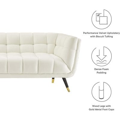 Elegant white velvet sofa with tufted design and gold metal foot caps, perfect for contemporary living room decor and stylish seating solutions.