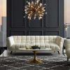 Elegant modern living room with stylish white sofa, contemporary chandelier, and chic wall paneling, perfect for upscale interior design and home decor.