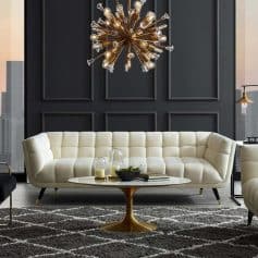 Elegant modern living room with stylish white sofa, contemporary chandelier, and chic wall paneling, perfect for upscale interior design and home decor.