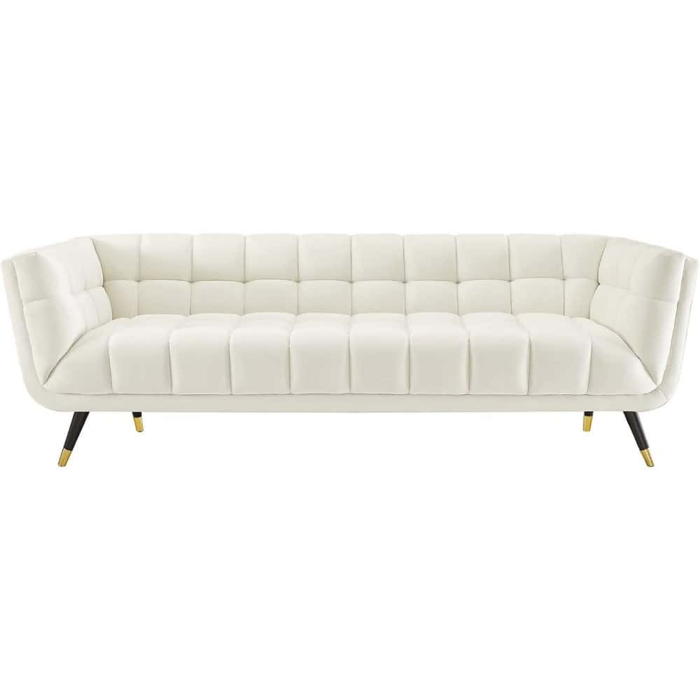 Elegant white sofa for modern living room decor with tufted design and wooden legs. Perfect for home or office interiors.
