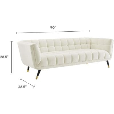 Elegant white sofa with tufted cushioning, perfect for stylish living rooms and office waiting areas. Durable design, measuring 90” x 28.5” x 36.5”, offering comfort and sophistication.