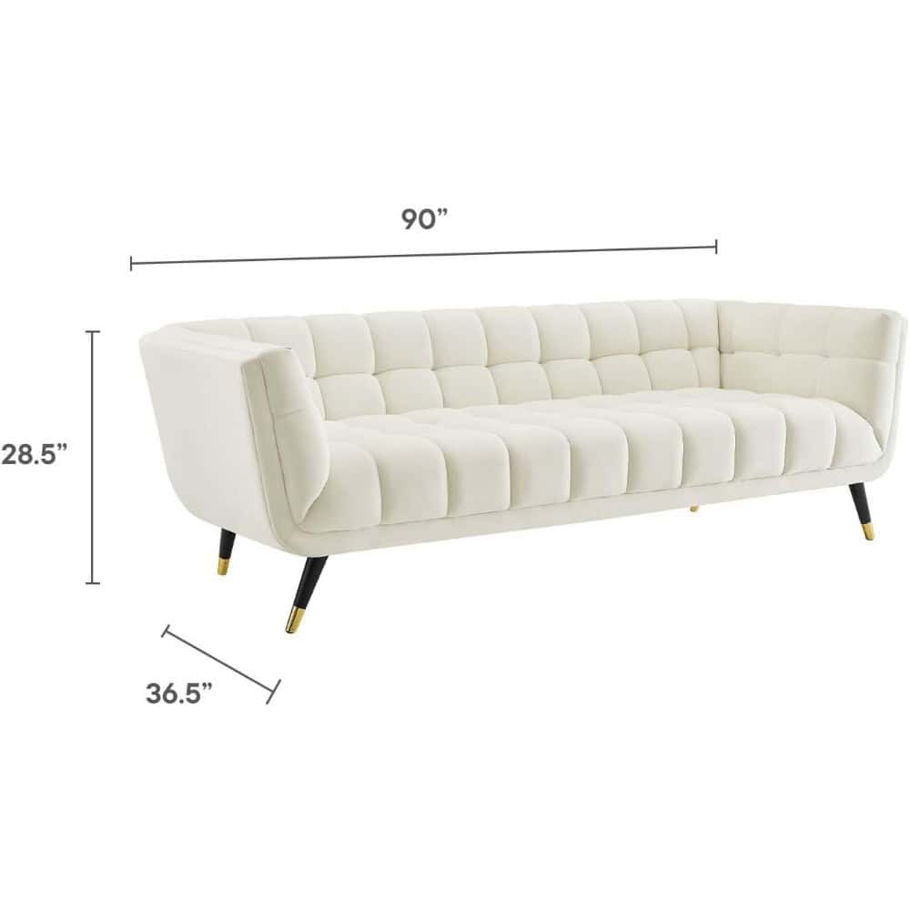 Elegant white sofa with tufted cushioning, perfect for stylish living rooms and office waiting areas. Durable design, measuring 90” x 28.5” x 36.5”, offering comfort and sophistication.