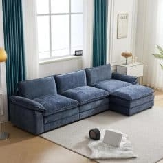 Comfortable blue velvet sectional sofa with plush cushions in elegant living room setting.