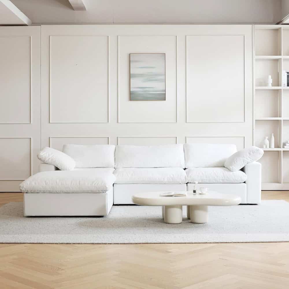 Elegant white sofa in a contemporary living space, perfect for modern home decor, comfort, and stylish design. Ideal for living room setups seeking a clean, sophisticated aesthetic.