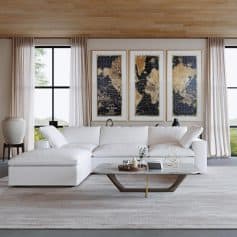 Bright living space featuring world map art, elegant white sofa, and spacious windows for an inviting atmosphere.