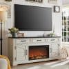 Elegant white TV stand with fireplace and decor accessories for living room.