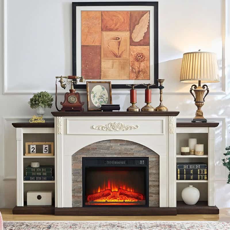 A beautifully decorated living room fireplace with elegant ornaments, candles, framed artwork, and a vintage lamp, creating a warm and inviting atmosphere for home comfort and style.