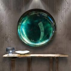 Elegant eyewear store decor with artistic wall feature and stylish display table for glasses and optical accessories.