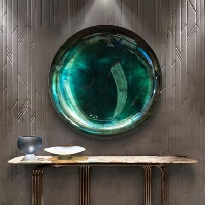 Elegant eyewear store decor with artistic wall feature and stylish display table for glasses and optical accessories.