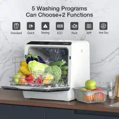 Fresh vegetables inside a compact, modern dishwasher with multiple washing programs, ideal for efficient kitchen cleaning and food preservation.