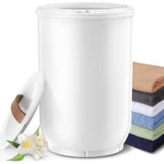 Laundry ozone sanitizer, compact white washing machine with control panel, towels and flowers, clean home, health hygiene, eco-friendly laundry appliance, Monalisa Medical.