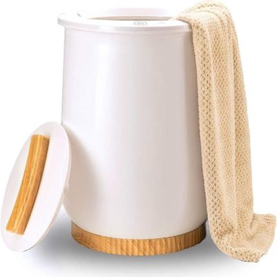 Washer with beige towel and wooden lid, modern laundry dryer appliance, sleek white design for home use, energy-efficient and space-saving.