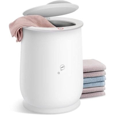 Dry laundry sanitizer sterilizer for clothes, modern white laundry sterilizer with towels, premium laundry sterilizer for hygienic clothes care, advanced laundry sterilization device for fresh and clean clothing, relevance: high.